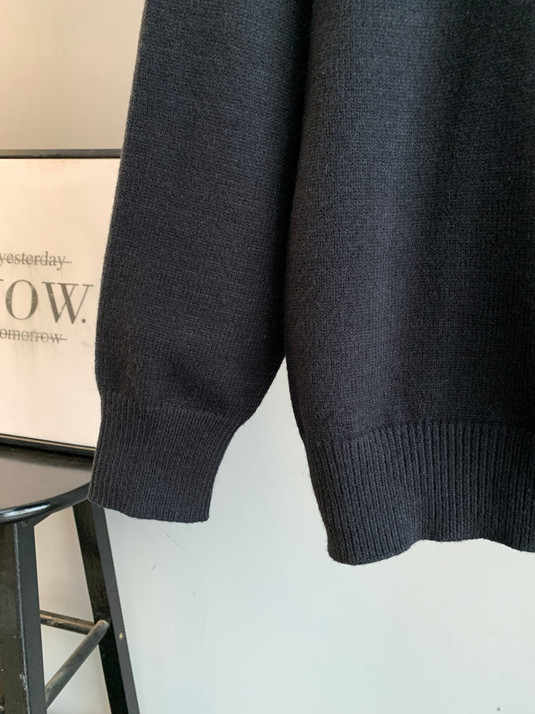 Charcoal knit sweater with ribbed cuff and straight hem