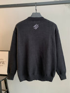 Charcoal knit crewneck sweater back with small embroidered white text