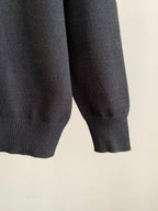 Charcoal knit sweater sleeve with ribbed cuff detail