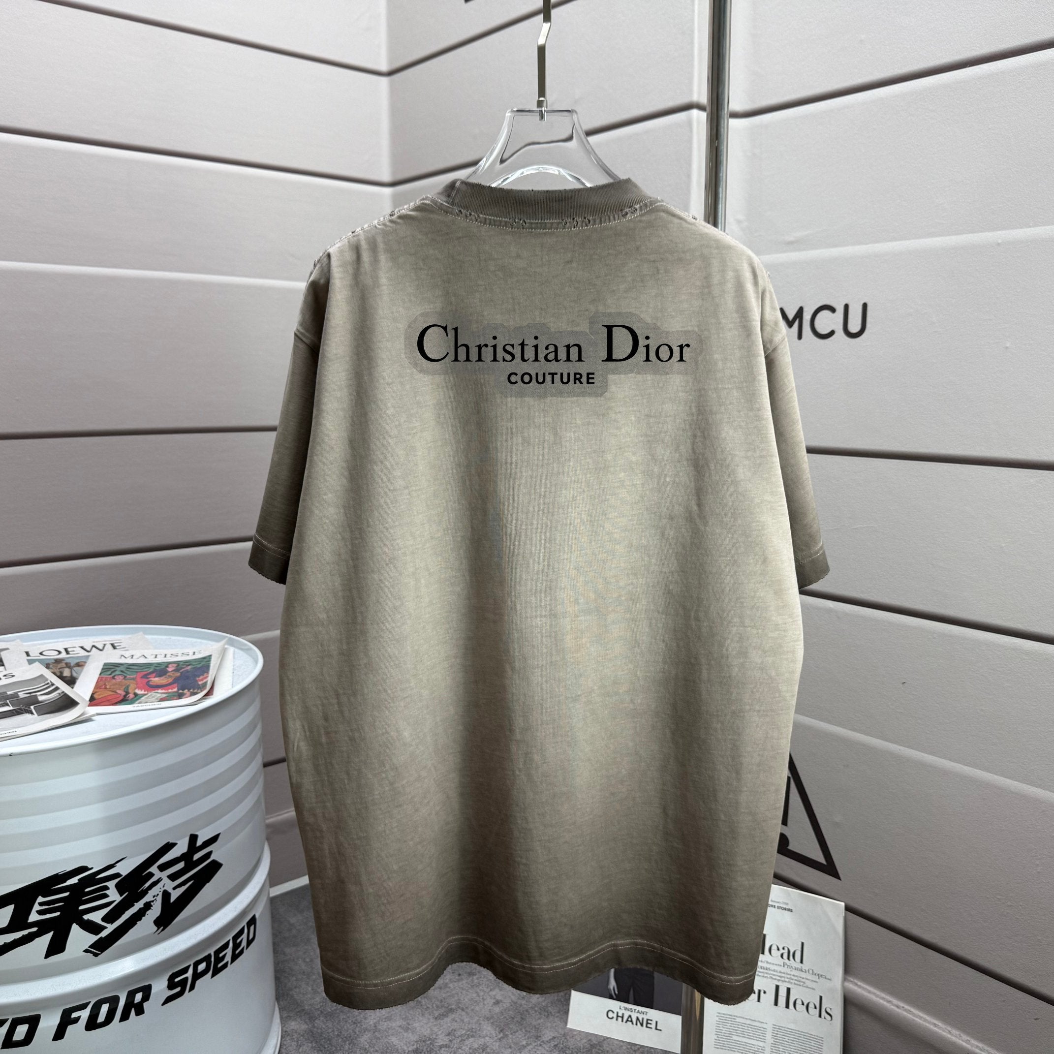 Khaki short-sleeve T-shirt with Christian Dior text on back, crew neck