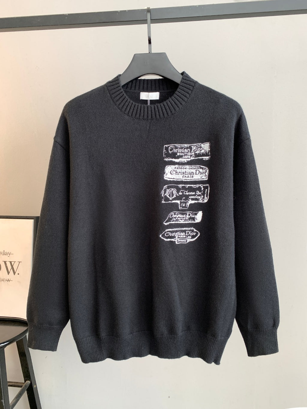 Dark crewneck knit sweater with ribbed collar and stacked Dior logo patches