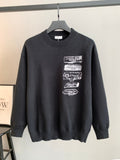 Dark crewneck knit sweater with ribbed collar and stacked Dior logo patches