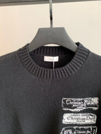Dark ribbed crewneck sweater with Christian Dior logo patch at chest