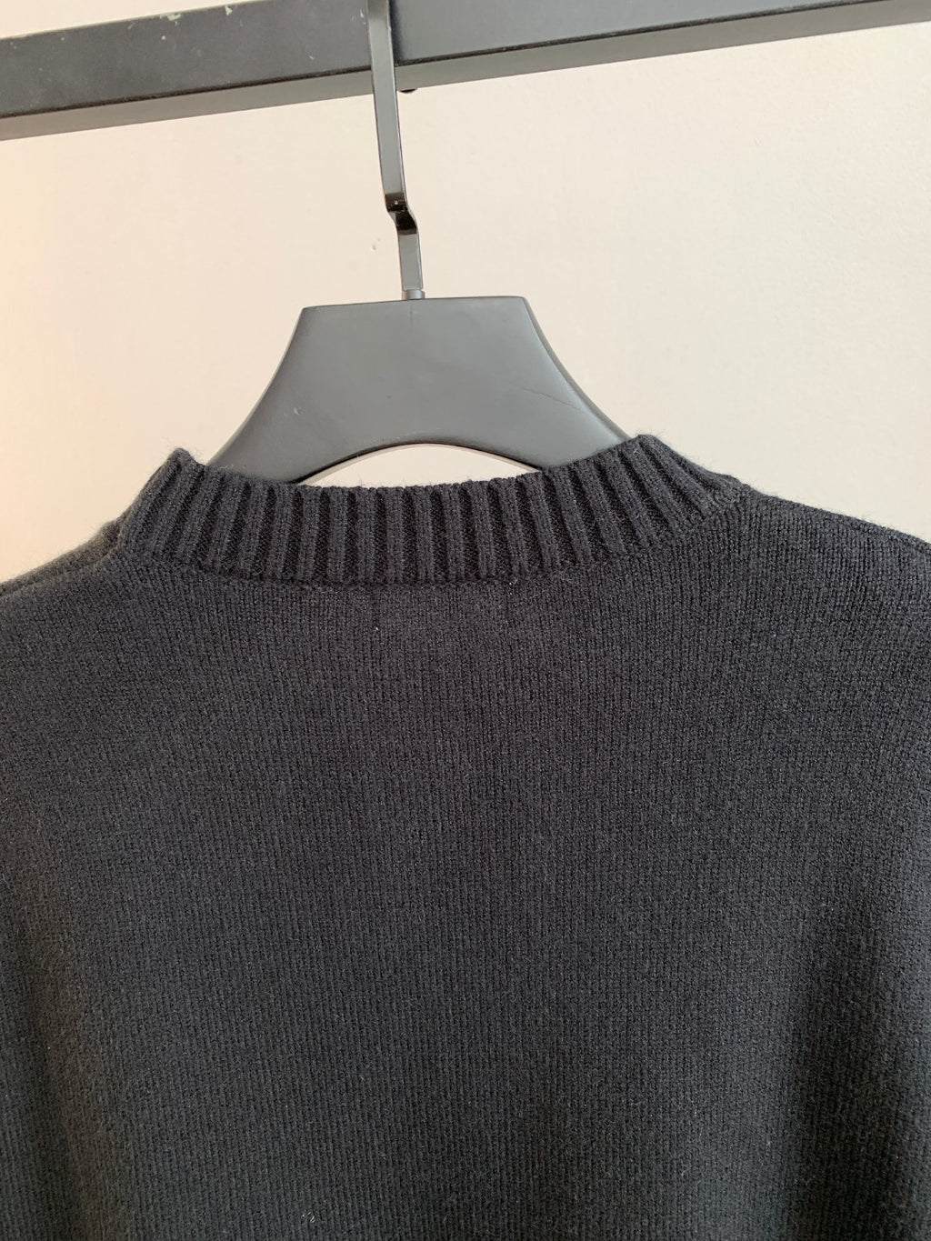 Dark crewneck knit sweater with ribbed neckline detail