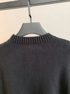 Dark crewneck knit sweater with ribbed neckline detail