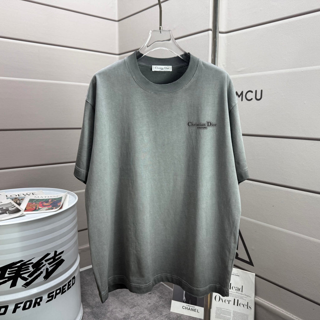 Light gray short-sleeve T-shirt with small Christian Dior logo on front chest.