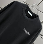 Black Dior T-shirt, crew neck and small chest Dior logo close-up