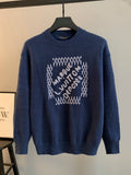 Navy blue knit crewneck sweater with beaded graphic on front
