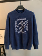 Navy blue knit crewneck sweater with beaded graphic on front