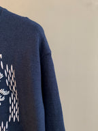 Navy blue knit sweater sleeve cuff with ribbed hem