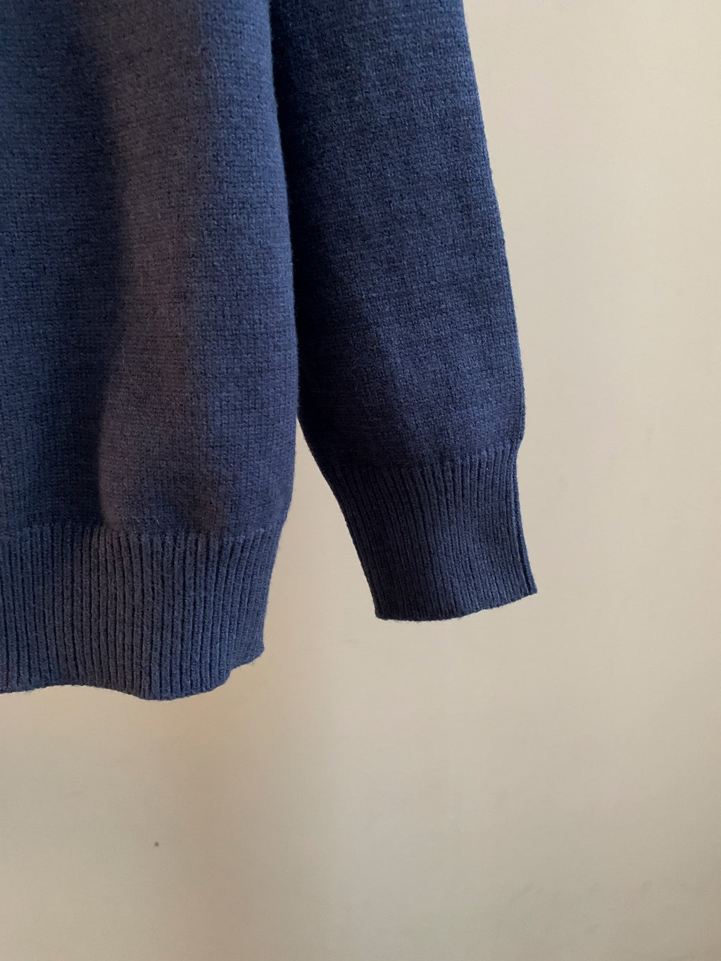 Navy blue knit sweater ribbed cuff and partial side seam