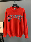 Givenchy red knit sweater with bold GIVENCHY logo across the chest