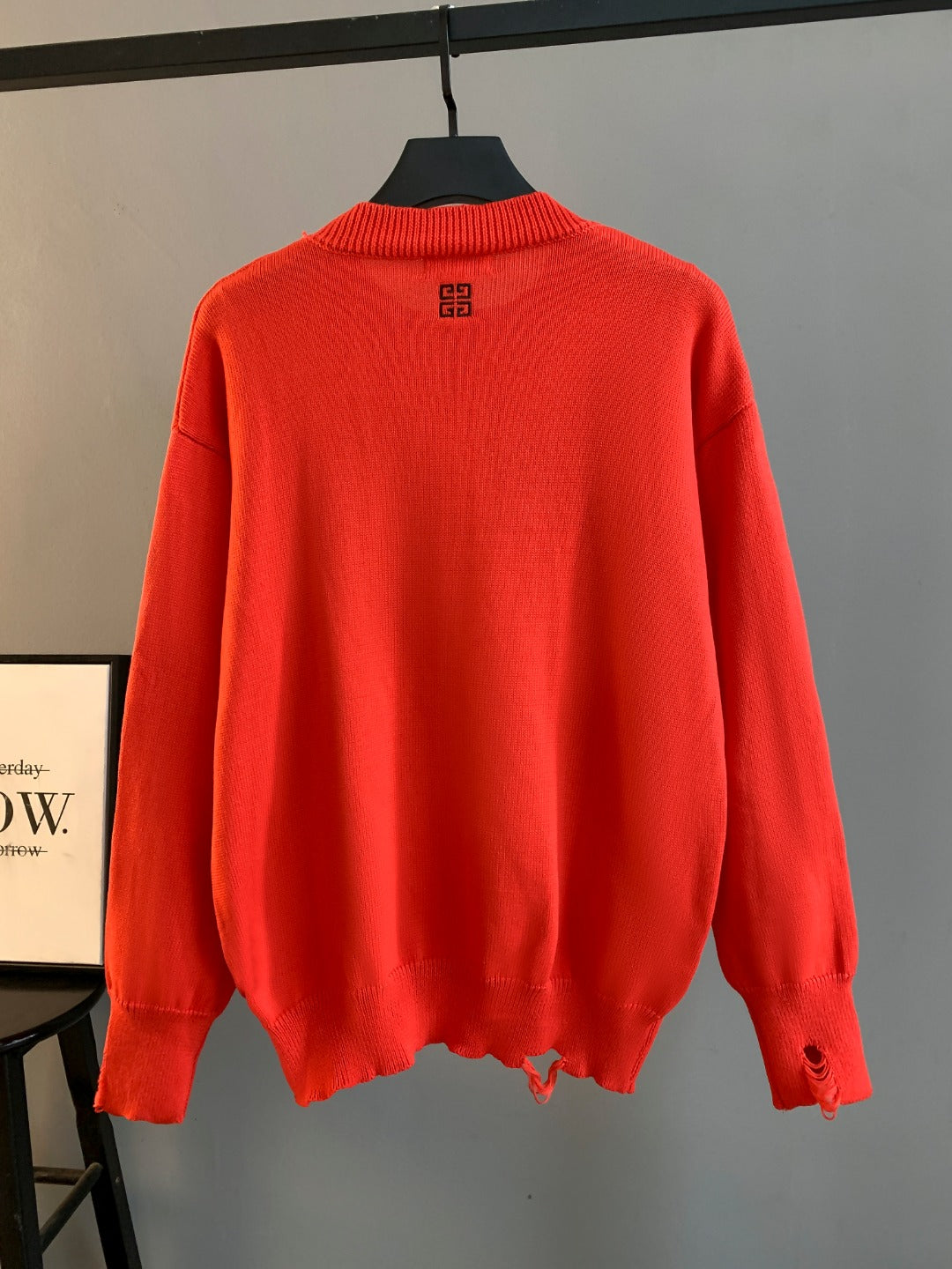 Givenchy red knit sweater, back view with small logo near neckline