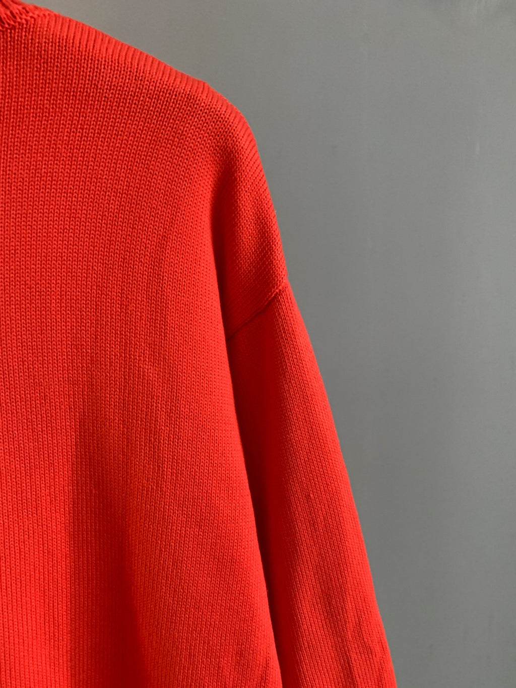 Givenchy red knit sweater with smooth knit texture and side seam