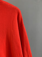 Givenchy red knit sweater with smooth knit texture and side seam