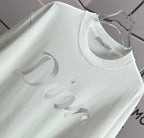 White Dior T-shirt neckline with small logo tag and 'Dior' print detail