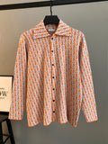 Dior long-sleeve shirt with orange-and-blue repeating logo pattern, button front