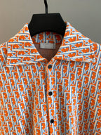 Dior logo-print long-sleeve shirt, orange collar and button placket close-up