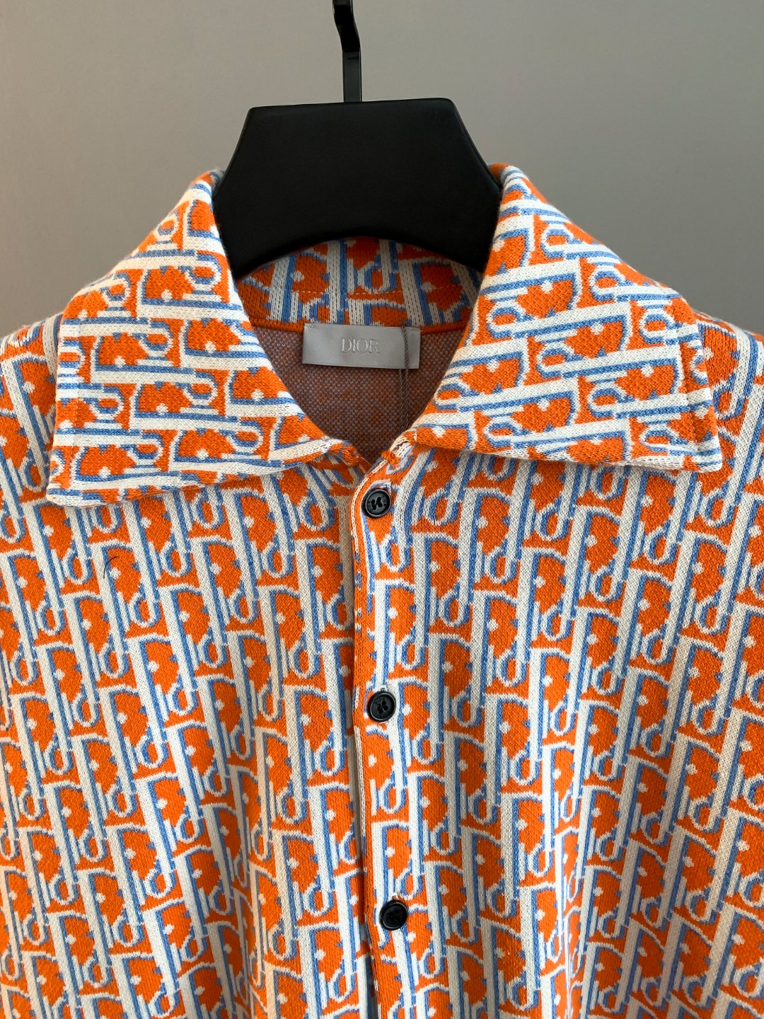 Dior logo-print long-sleeve shirt, orange collar and button placket close-up