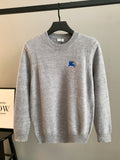 Gray crewneck knit sweater with blue horse logo on the chest, long sleeves