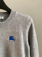 Heather gray knit sweater with long sleeve and small blue horse logo