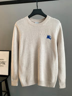 Burberry long sweater, cream knit with small blue horse logo on chest