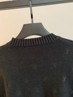 Dark knit sweater close-up of ribbed crew neck with LV monogram pattern