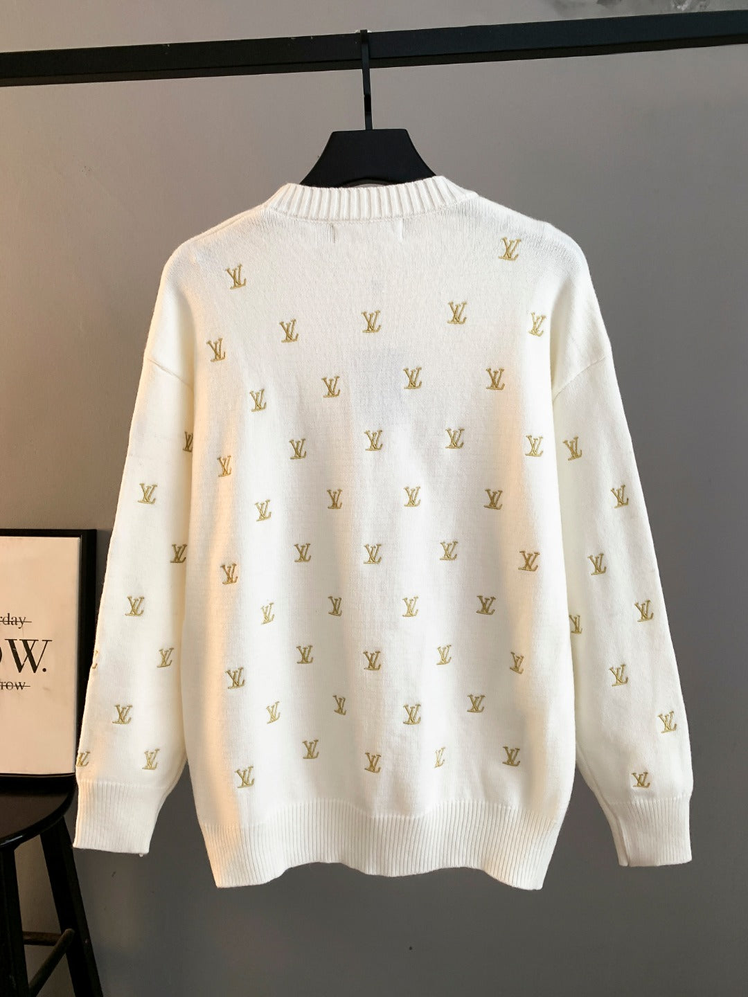 White knit sweater with gold Louis Vuitton monogram pattern, back view, crew neck
