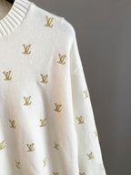 White knit sweater with gold Louis Vuitton monogram pattern, side sleeve detail