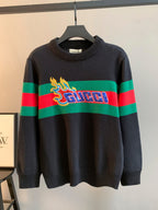 Gucci knit sweater with crew neck, dark base and green/red stripe with flame logo