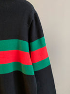 Gucci knit sweater side view showing wide green and red stripes on dark knit