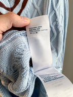 Sweater care label showing cotton content and PRINCIPAL: MAIN composition tag