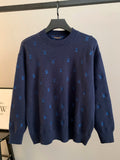 Dark navy knit sweater with blue Louis Vuitton monogram pattern and ribbed crew neck