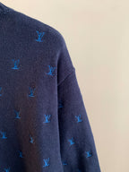 Dark navy knit sweater side close-up with blue Louis Vuitton monogram pattern