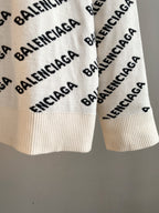 Crewneck sweater sleeves in cream with black BALENCIAGA logo pattern; ribbed cuffs