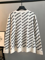 Cream knit sweater with repeating Balenciaga logo pattern, ribbed crew neck and cuffs