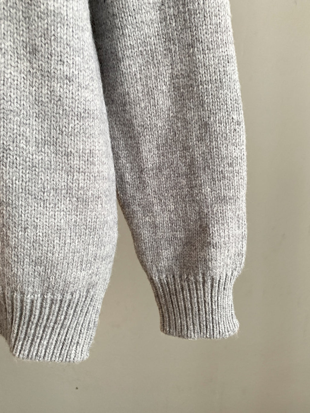 Dior grey knit sweater sleeve with ribbed cuff
