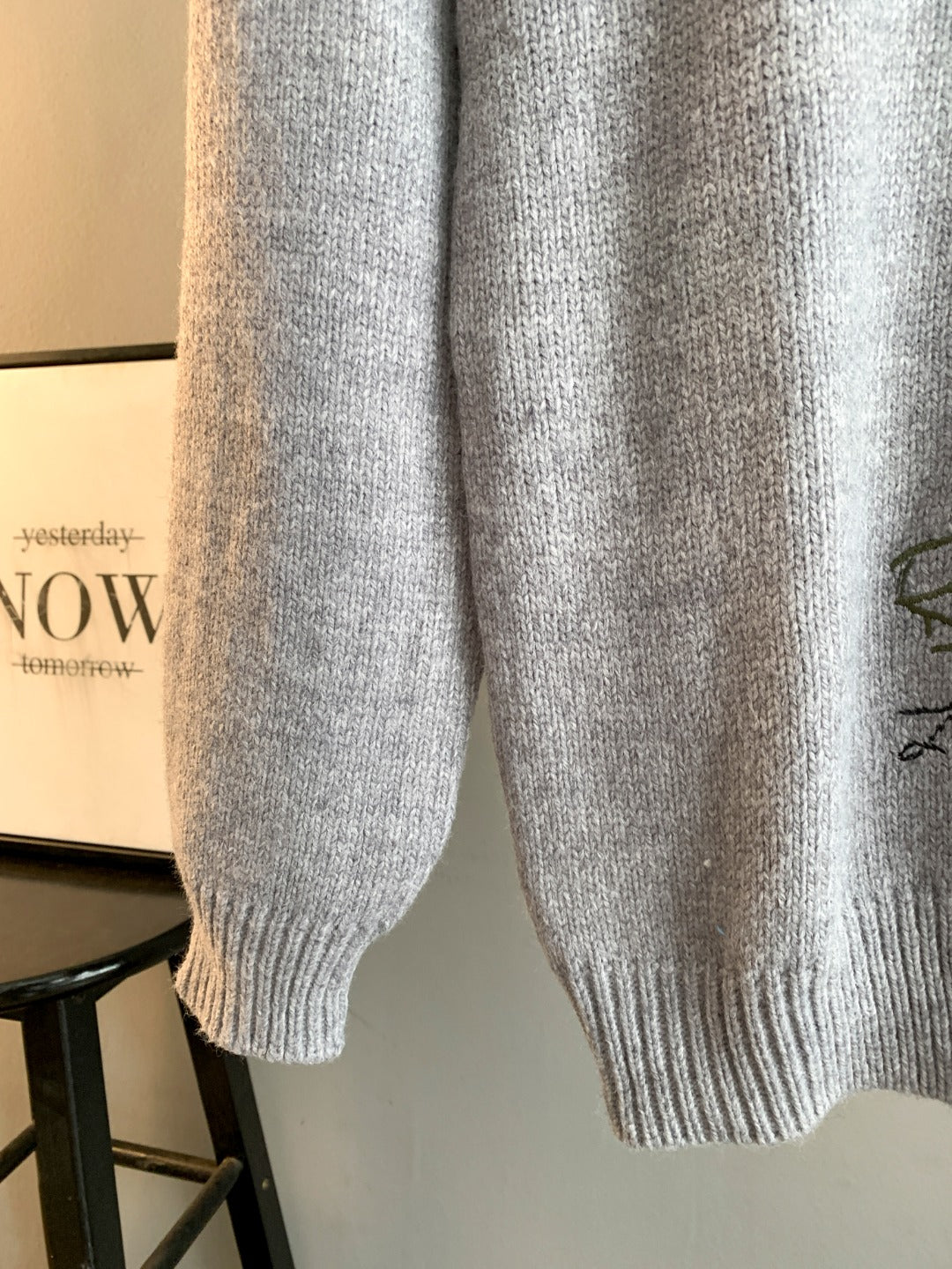 Dior grey knit sweater lower section with ribbed hem and cuffs