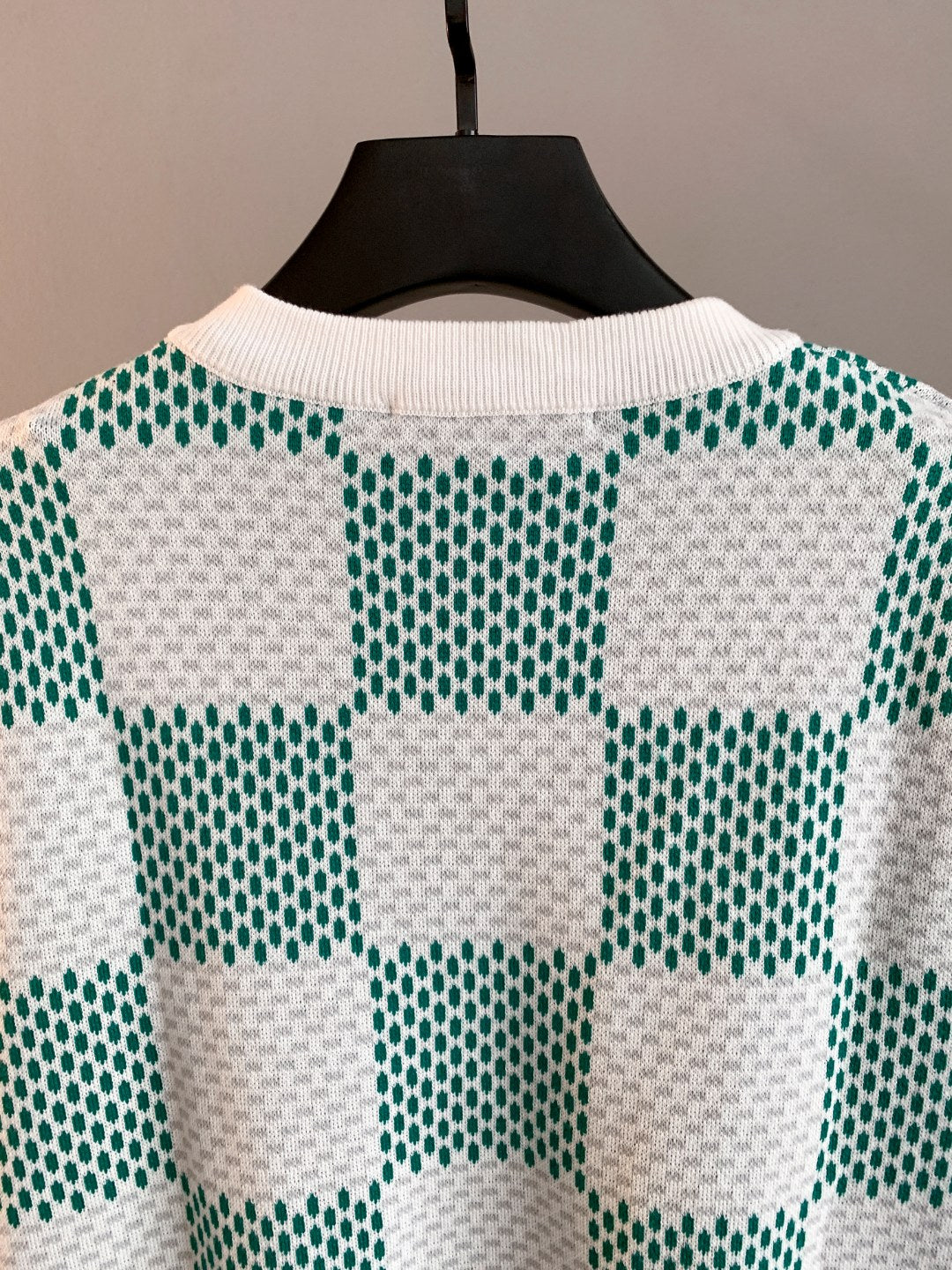 Back view crewneck sweater with green-and-white check squares knit