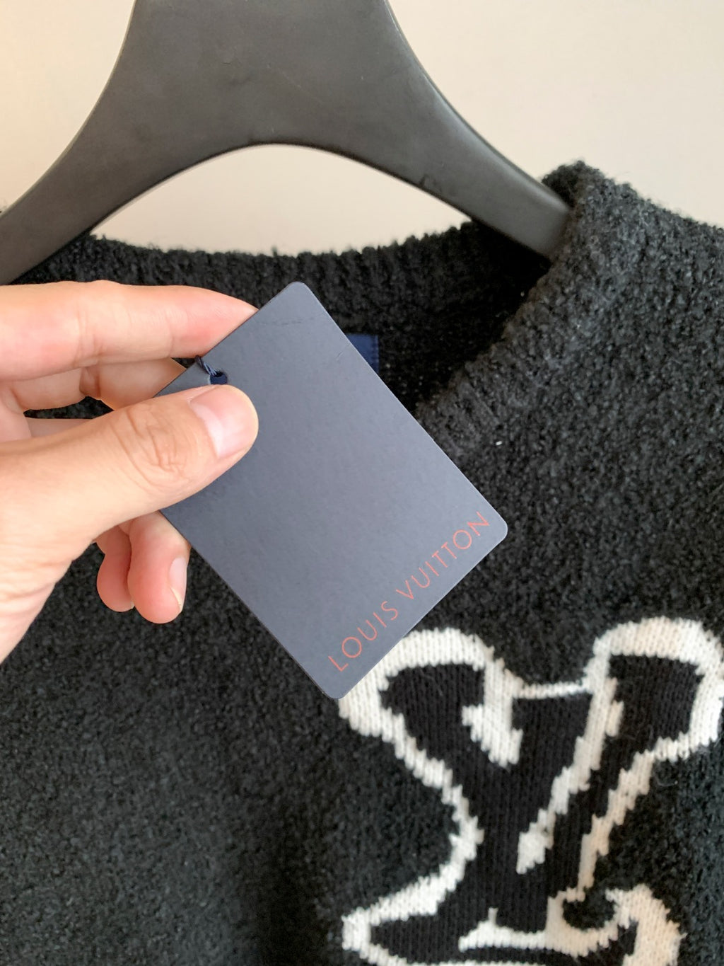 Louis Vuitton long-sleeve sweater with hanging tag, dark charcoal and white emblem