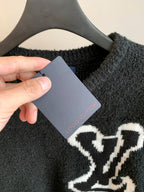 Louis Vuitton long-sleeve sweater with hanging tag, dark charcoal and white emblem
