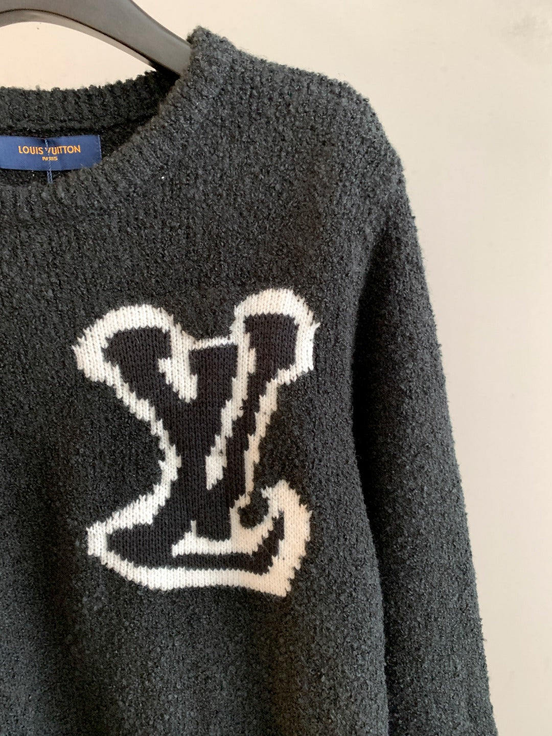 Louis Vuitton long-sleeve sweater, dark charcoal with large white emblem on chest