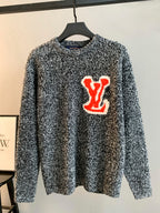 Louis Vuitton knit sweater speckled black/white with red LV graphic on chest