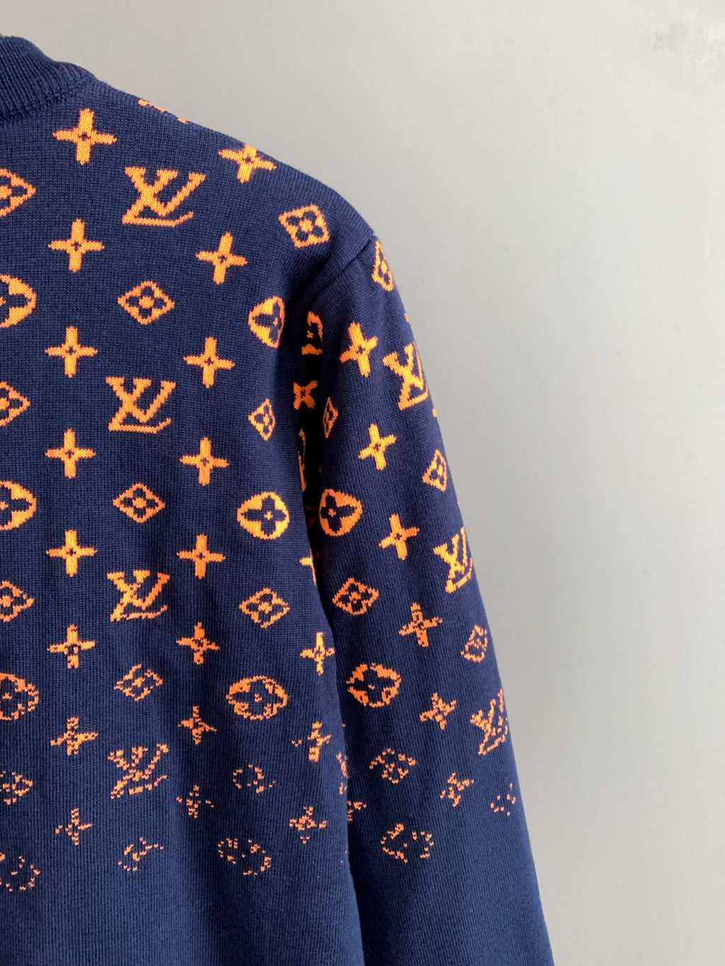 Louis Vuitton logo sweater sleeve in navy with orange monogram pattern
