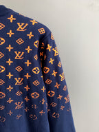 Louis Vuitton logo sweater sleeve in navy with orange monogram pattern