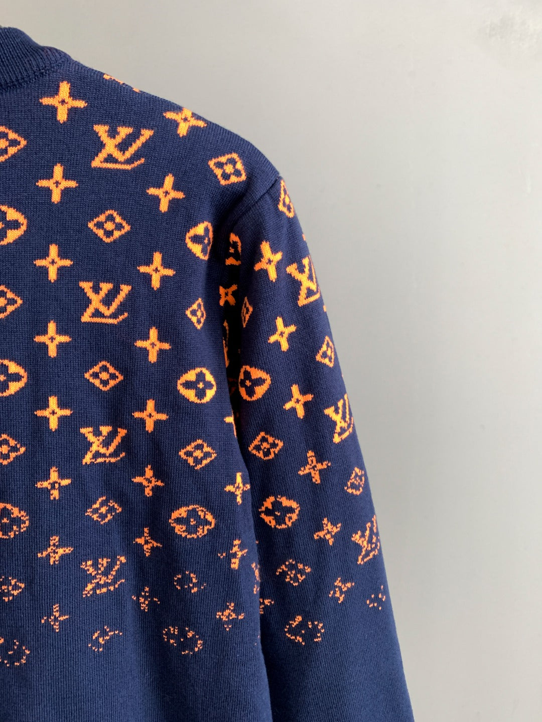 Louis Vuitton logo sweater sleeve in navy with orange monogram pattern