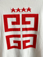 White knit cardigan back close-up of red crest graphic and star motifs