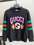 Gucci knit sweater in dark gray with large colorful “GUCCI” logo on front