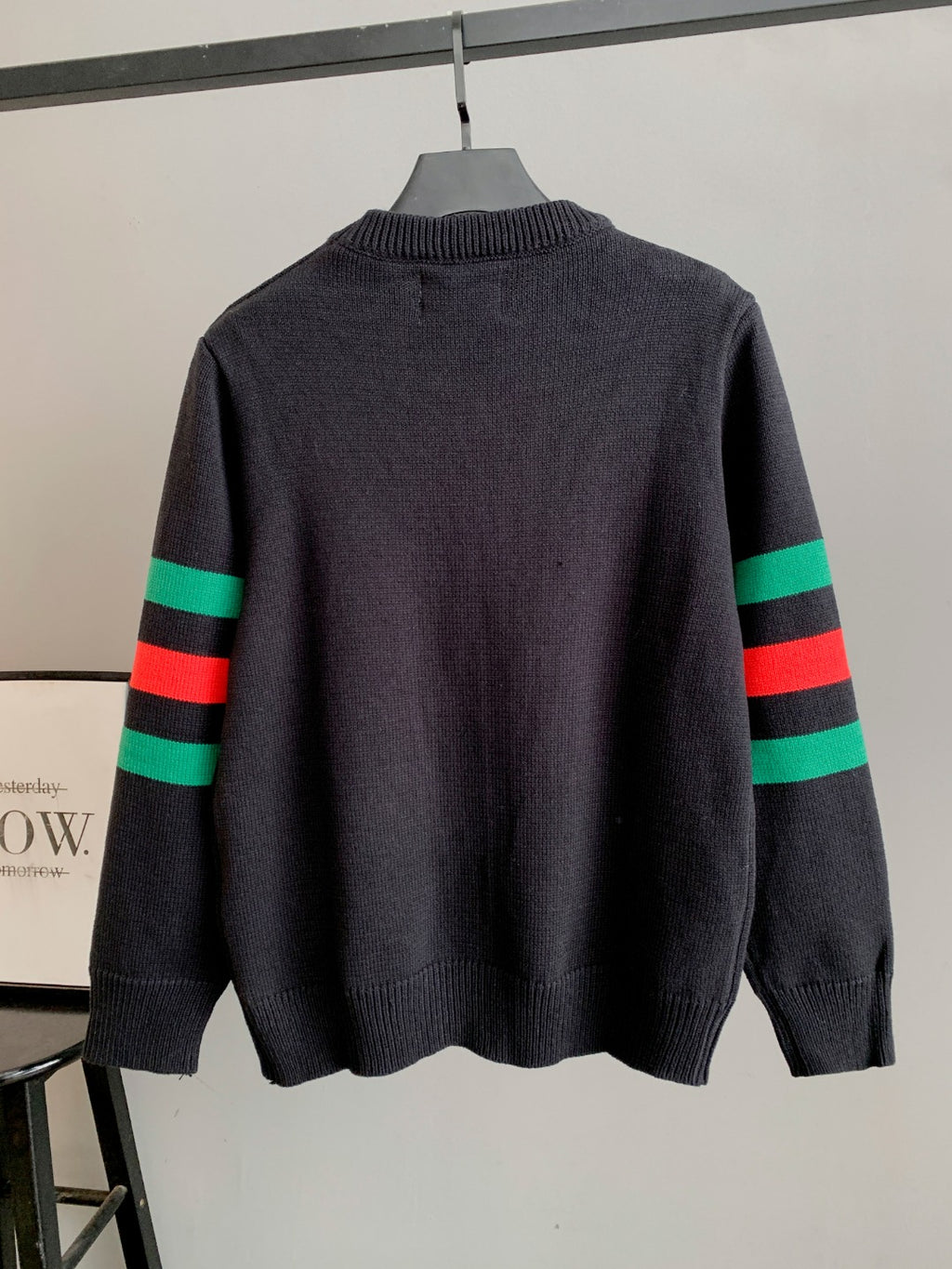 Gucci knit sweater in dark gray, back view with green and red striped sleeves