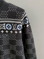 Side view long-sleeve knit sweater with white monogram band across sleeve